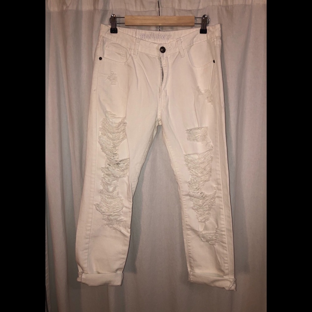 Distressed white jeans